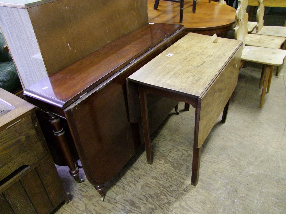 Drop leaf dining table on brass casters : length 148cm together with a smaller distressed drop