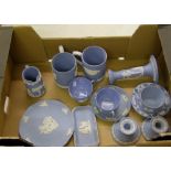 A collection of Wedgwood blue jasperware items: to include tankards, candle holders etc (14).