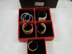 A quantity of Chavin branded carved horn bangles: boxed (5).