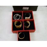 A quantity of Chavin branded carved horn bangles: boxed (5).