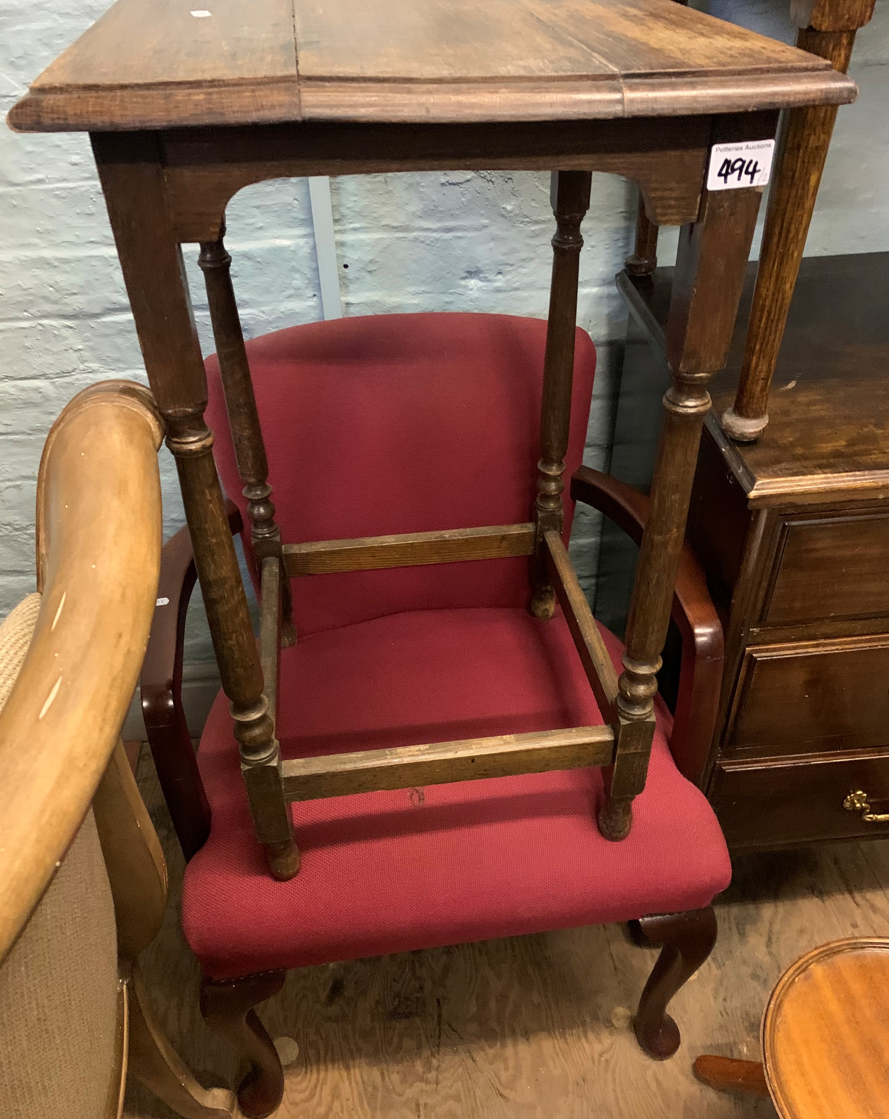 A square oak side table: together with an upholstered open armchair