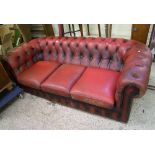 Three seater red Chesterfield settee: in need of some attention