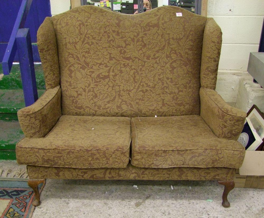 Two seater upholstered wing backed sofa: