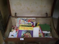 A vintage leather suitcase: containing annuals and other vintage books.