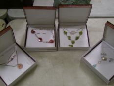 A quantity of leather boxed Chavin Sterling Silver and semi precious stone necklaces: (4).