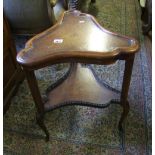 Early 20th Century two tiered table : with gallery lower tier and leather topped shelf