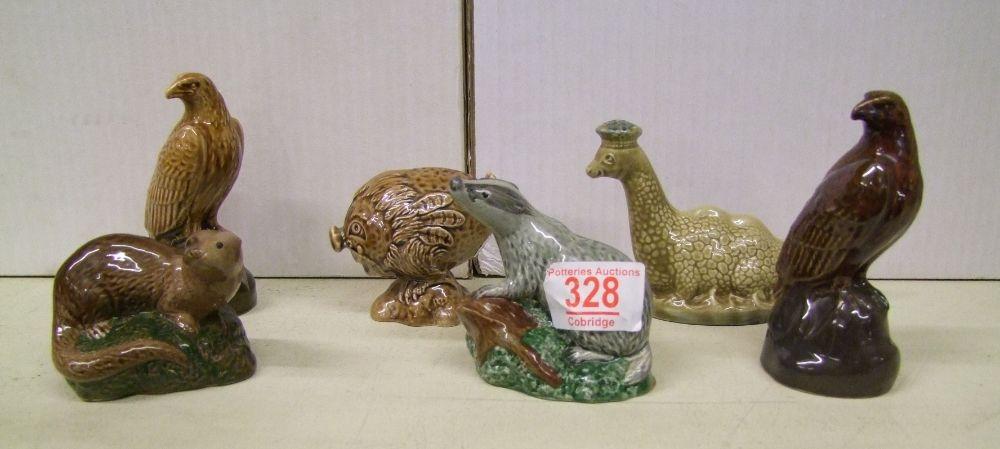 Beswick whisky decanters to include: otter, badger, eagle x 2, haggis, loch ness monster. All full