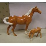 Beswick palomino swish tail horse: 1 ear reglued together with a Royal Doulton palomino grazing foal