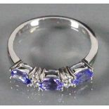 18ct gold ladies ring set with 3 Sapphires and Diamonds: Size N 3.3g.