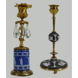 Wedgwood back Jasperware Candlestick with brass fitting: Together with similar item, tallest 23cm.