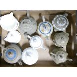 A collection of various Wedgwood tea pots and sugar bowls: Including embossed, salt glazed,