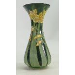 Lise B Moorcroft part glazed vase: In green with daffodils. Chip to rim. 21cm high. 2009.