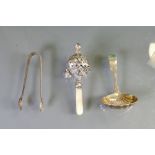 Early 20th century silver childs rattle with mother of pearl handle plus silver tongs and spoon,