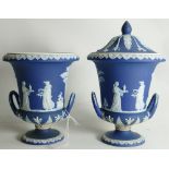 Wedgwood dark blue dip two handled urns (lacking one cover): Pair of, height 17cm.