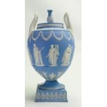 Wedgwood Jasperware handled Urn & Cover: Restoration noted to foot of urn above squared base,