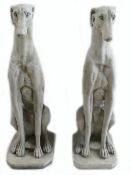 A pair of large reconstituted stone ornaments in the form of Greyhounds: Made in England and are