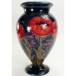 William Moorcroft Burslem pedestal vase decorated in the Big Poppy design: Height 28cm.