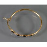 9ct gold Diamond and Sapphire bangle: 4.8g.