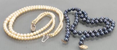 String of black cultured Pearls: Together with double row graduated cultured pearls,