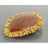 Goldstone & yellow coloured metal very large brooch: Measuring 60mm high, weight 19.4g gross.