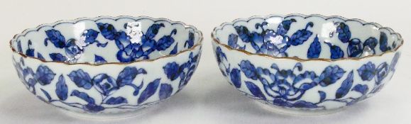 Pair of Chinese porcelain blue & white bowls with floral decoration: Diameter 13.5cm.