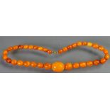Art Deco string of Butterscotch amber beads: Length 40cm, 20g.