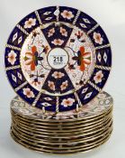 Twelve Royal Crown Derby Imari pattern plates: 23.5cm diameter.
