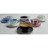 A collection of Shelley Cup and saucers to include: Dainty 14114 Shamrock,