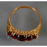 9ct ladies dress ring set with 5 Garnets: Size R, 3.3g.