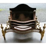A Regency style brass and cast iron Serpentine fire grate with urn finials: 60cm high x 78cm wide x