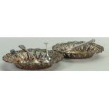 A collection of silver items: Including a pair of ornate silver dishes,