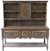 20th century Elizabethan style Oak dresser: 3 drawer base with plate rack,