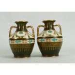 Pair of Wedgwood small Earthenware Portland vases: Decorated with scrolling foliage, height 11cm.