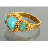 Yellow coloured metal ring set Turquoise: Weight 3.8g gross. Of overseas origin.