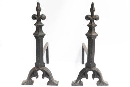 A pair of Gothic Revival cast iron Firedogs: In the manner of A W N Pugin.