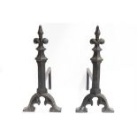 A pair of Gothic Revival cast iron Firedogs: In the manner of A W N Pugin.