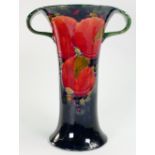 William Moorcroft Burslem two handled vase decorated in the pomegranate design: Height 26cm.