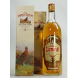 A bottle of Grants Whisky: 1 litre together with two bottles of Famous Grouse 70cl.