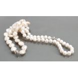 Two strings of freshwater Pearls with silver magnetic catches: Measuring 48cm & 50cm long.