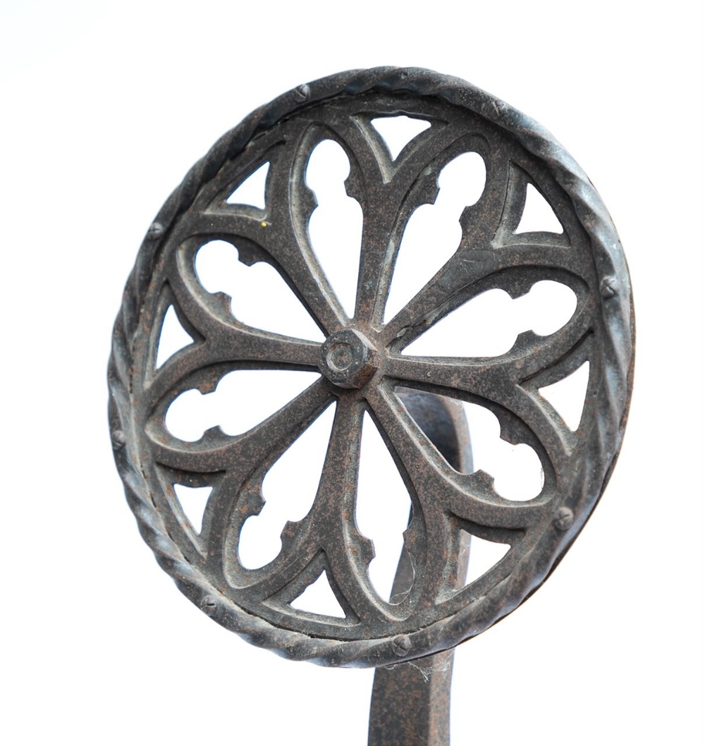 A pair of Arts and Crafts wrought iron Firedogs: With Gothic rose window tracery finials. - Image 2 of 2