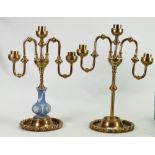 Pair of gilded brass candlesticks: One mounted with a small Wedgwood vase, height 34cm.