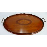 Satinwood Sheraton style oval tea tray: Inlaid with shell decoration and brass handles.