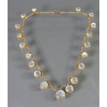 Ladies necklace set 19 round Moonstones in gold: Tested as higher than 9ct.