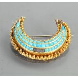 Yellow coloured metal brooch set Turquoise: Weight 9.5g gross, 37mm wide. Of overseas origin.