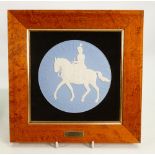 Wedgwood round plaque of Elizabeth II riding horseback: Dated 1977 by Arnold Machin, walnut frame,