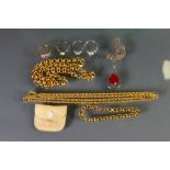 A collection of jewellery items: Including gold plated necklaces, silver dress rings etc.