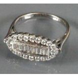 18ct White gold ladies ring centre set with 9 baguette diamonds surrounded by round cut diamonds: