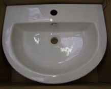 A brand new white bathroom sink: by soak.com model CA632FB. boxed