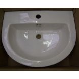 A brand new white bathroom sink: by soak.com model CA632FB. boxed