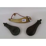 Two antique powder flasks: and powder horn (3)